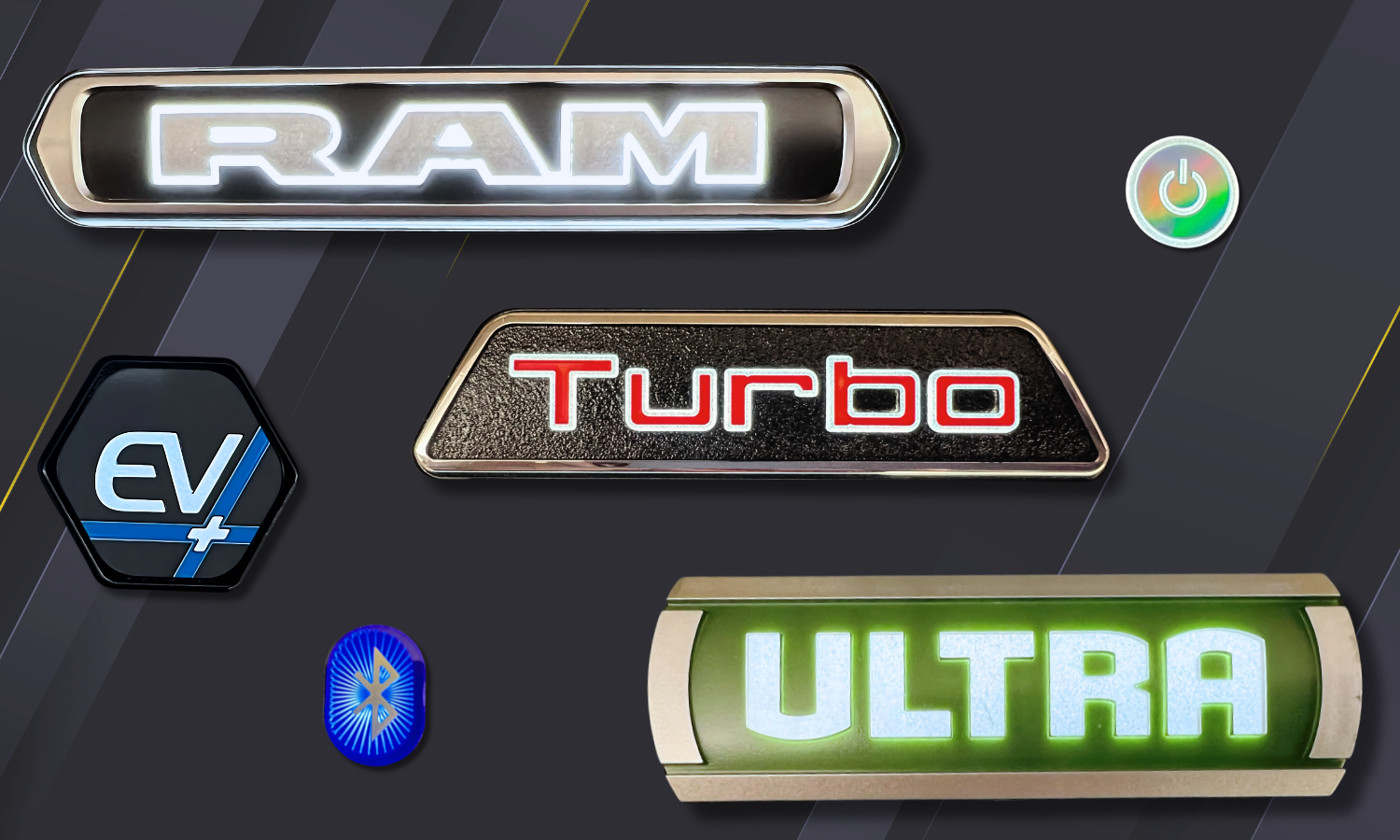 Collage of branded nameplates that have either the perimeter backlit with a light source coming through, or their text is backlit so light shines through. A mix of plastic and various metals like stainless steel, aluminum, and electroform. 